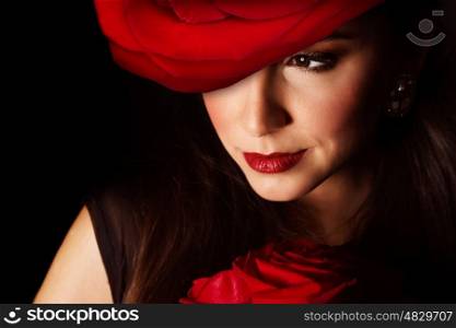 Pictire of sexy woman with great red rose hat on the head isolated on black background, closeup portrait of stylish girl with flowers bouquet, Valentine day, beauty and styling salon, elegance concept