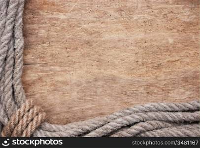 picture frame of rope on a old wooden background