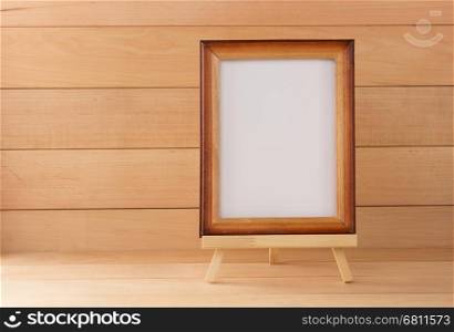picture frame on wooden background