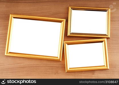 Picture frames on the polished wooden background