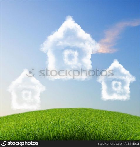 Picture of a house from white clouds against blue sky