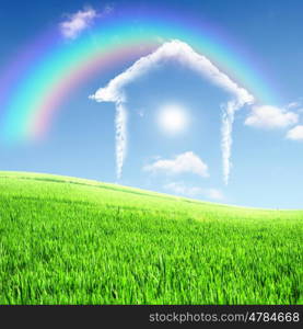 Picture of a house from white clouds against blue sky