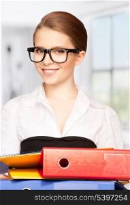 picture of a young attractive businesswoman with folders