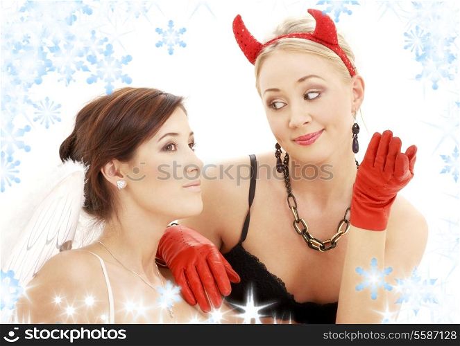 picture of angel and devil girls with snowflakes