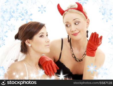 picture of angel and devil girls with snowflakes