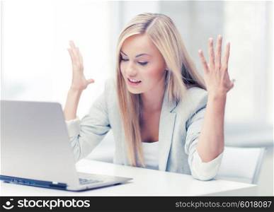 picture of angry businesswoman with laptop at work. angry woman with laptop