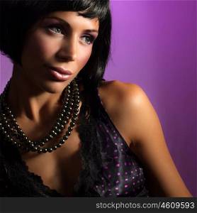 Picture of attractive brunet girl wearing stylish accessories, closeup portrait of pretty woman in glamorous black pearl beads, cute female with fashionable haircut, New Year party