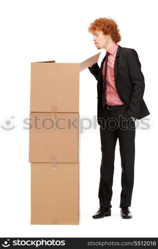 picture of attractive businessman with big boxes