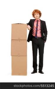 picture of attractive businessman with big boxes