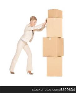 picture of attractive businesswoman moving big boxes