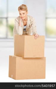 picture of attractive businesswoman with big boxes