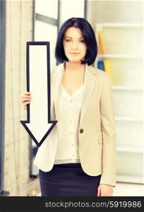picture of attractive businesswoman with direction arrow sign. businesswoman with direction arrow sign