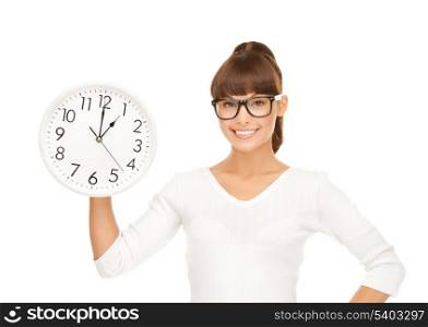 picture of attractive businesswoman with wall clock