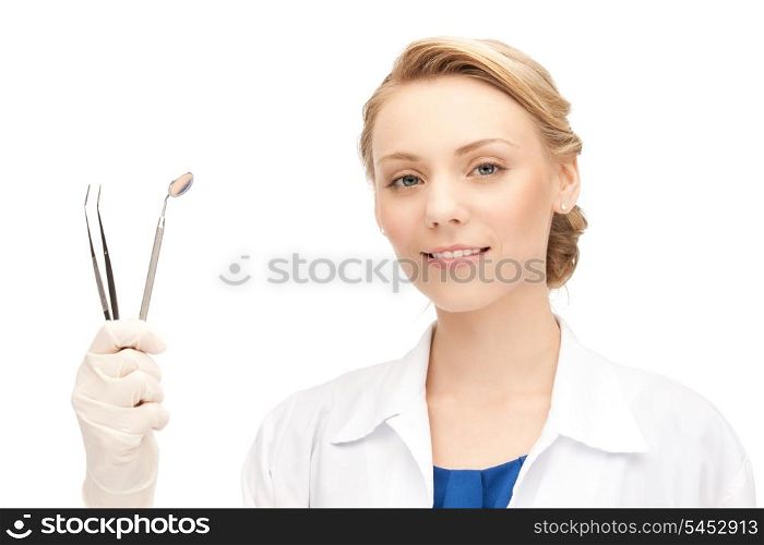 picture of attractive female dentist with tools....