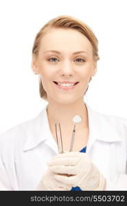 picture of attractive female dentist with tools