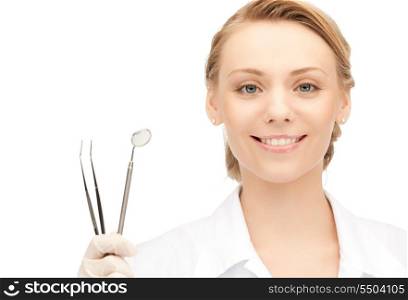 picture of attractive female dentist with tools