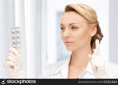 picture of attractive female doctor with pills