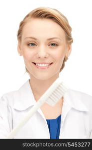 picture of attractive female doctor with toothbrush...