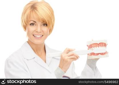 picture of attractive female doctor with toothbrush and jaws&#xA;
