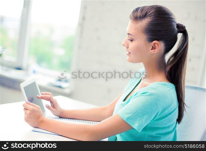picture of attractive student girl using tablet pc. attractive student girl using tablet pc