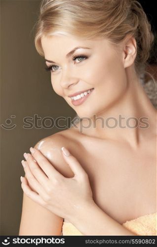 picture of attractive woman applying skin creme