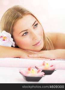 Picture of attractive woman enjoying dayspa, nice blond girl laying down on massage table in luxury spa salon, aroma therapy, beauty treatment, skin care, healthy lifestyle, relaxation concept