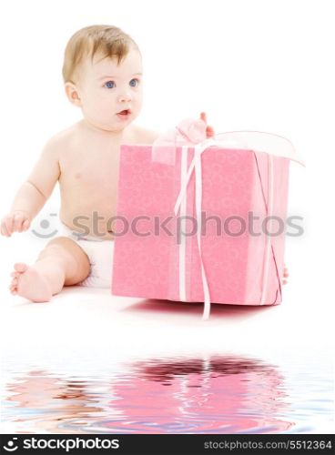 picture of baby boy in diaper with big gift box