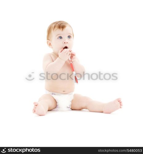 picture of baby boy in diaper with toothbrush
