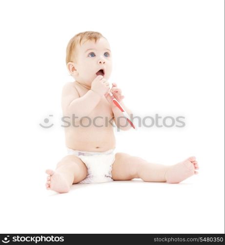picture of baby boy in diaper with toothbrush
