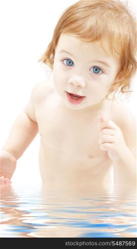 picture of baby boy in water over white