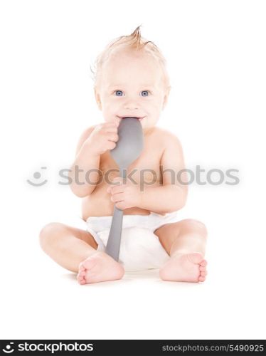picture of baby boy with big spoon over white