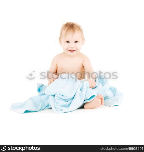 picture of baby boy with blue towel over white