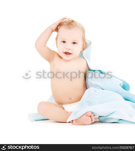 picture of baby boy with blue towel over white