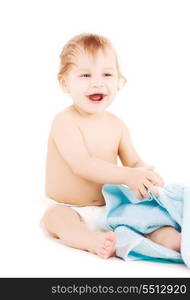 picture of baby boy with blue towel over white