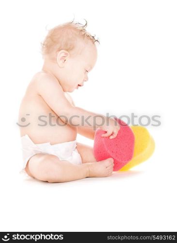 picture of baby boy with sponges over white