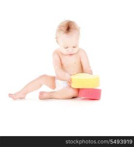 picture of baby boy with sponges over white