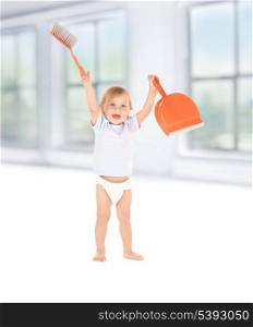 picture of baby boy with with dustpan and brush