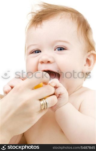 picture of baby boy with yellow plastic toy