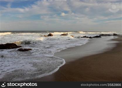 Picture of Beachfront with Rocks and Blue Skies