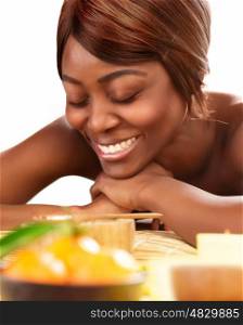 Picture of beautiful afro female with closed eyes lying down on massage table and enjoying dayspa, black young lady relaxed in luxury spa salon, skin care, healthy lifestyle, wellness concept&#xA;