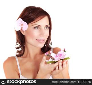 Picture of beautiful female wearing brassiere and holding in hands fresh orchid flower, closeup portrait of lovely woman with black hair, spa salon, beauty treatment, health care, purity concept