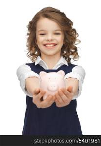 picture of beautiful girl with piggy bank
