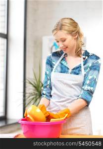 picture of beautiful housewife washing dish at the kitchen ..