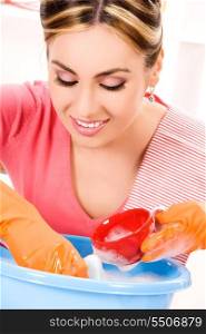 picture of beautiful housewife washing dish at the kitchen