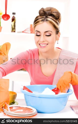 picture of beautiful housewife washing dish at the kitchen