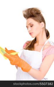 picture of beautiful housewife washing dish over white
