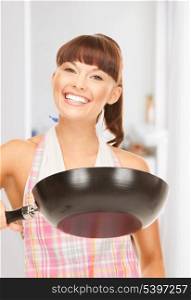 picture of beautiful housewife with frying pan