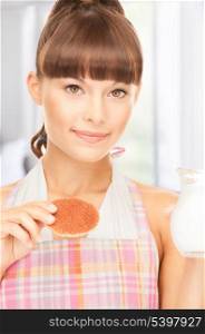 picture of beautiful housewife with milk and cookies