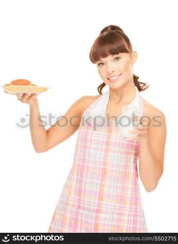 picture of beautiful housewife with milk and cookies&#xA;