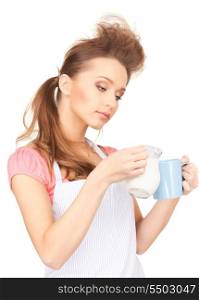 picture of beautiful housewife with milk and mug